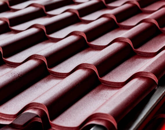 red-metallic-roof-tiles-background-with-drops-of-w-2025-10-16-12-45-46-utc